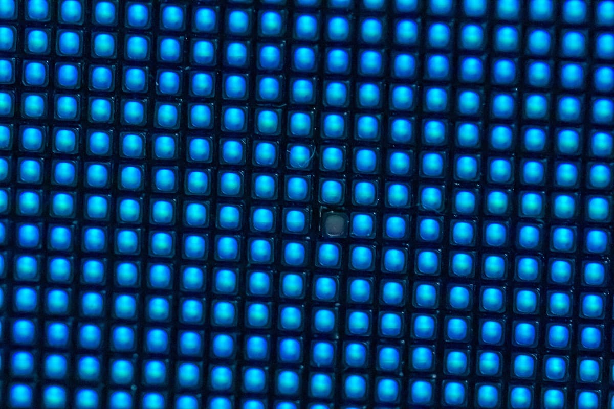 Close-up of LED module pixels glowing blue, showing the individual LED packages